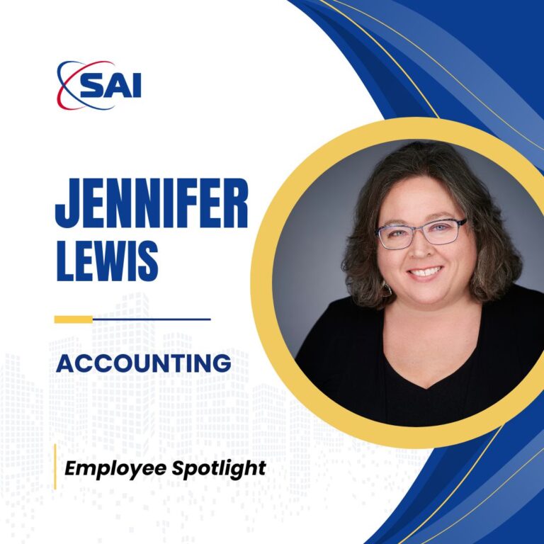 An image featuring an Employee Spotlight for Jennifer Lewis, who works in accounting. The design includes her smiling portrait inside a yellow circle on the right, the company logo labeled SAI on the top left, with her name in bold blue letters beneath it. The word 'Accounting' is highlighted, and 'Employee Spotlight' is written on the bottom left corner against a backdrop of a city silhouette.